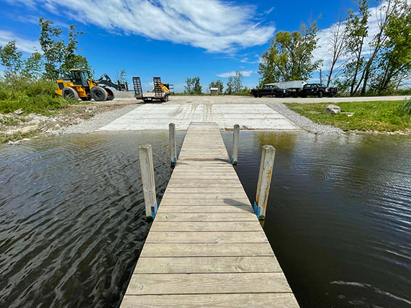 The completed boating access site is shown on a beautiful blue-sky day.