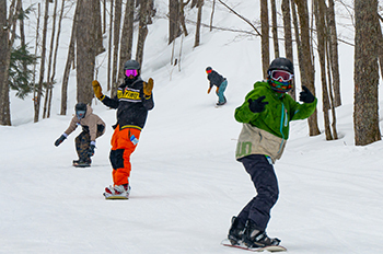 snowboarders riding the hill