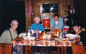 Jones family members celebrate with a 25th anniversary cake at Wilderness State Park.