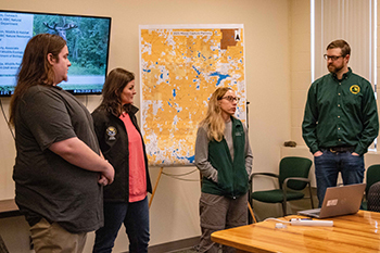 Representatives of the KBIC, NMU and the DNR partnering on the moose project address the media.