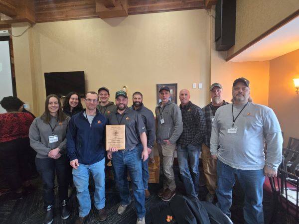 The staff of Green Timber Consulting Foresters celebrates the firm being named Stewardship Foresters of the Year for 2025.