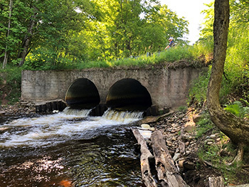 Two perched culverts at the Sucker River/H-58 road crossing will be replaced with a free span bridge.