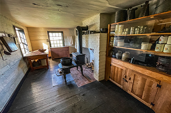 interior of historic buildings with stove and other cooking utensils