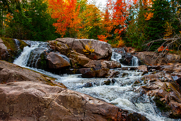 An autumn view from the base of an Upper Peninsula waterfall.