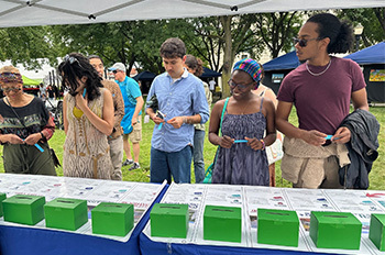 park visitors at table casting votes