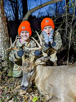 Olive and Briar Dean pose with Olive's harvested deer.