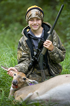 A young hunter poses with his deer harvest during the youth deer hunt.
