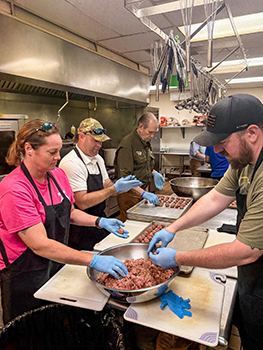 Hunters Feeding Michigan volunteers are shown making venison meatballs.