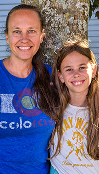 Jill Schuldlos and her 9-year-old daughter Mila are pictured posing for a photo.