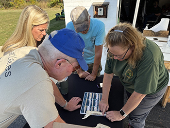 DNR staffer help hunters age deer using jaw bone