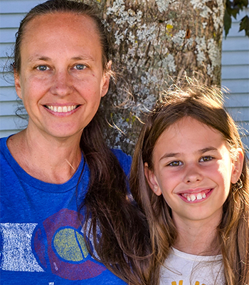 mother and daughter posing together