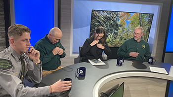 Panelists get microphones on before the November 2025 broadcast of "Ask the DNR."