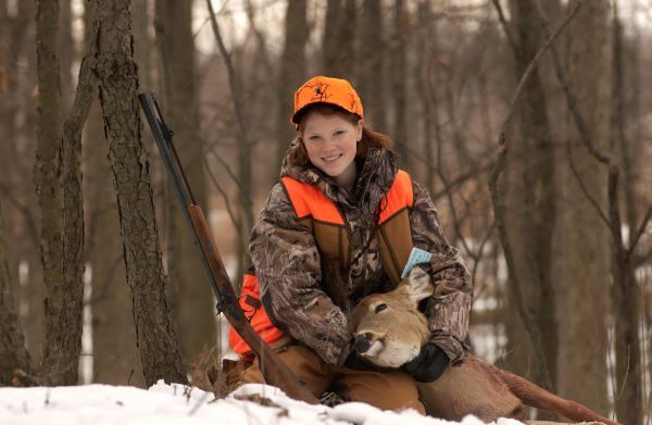 Hunter with harvested deer.