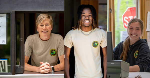 three summer park workers smiling and wearing shirts with DNR logos