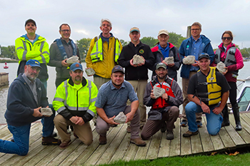 Project partners meeting on-site during reef construction.