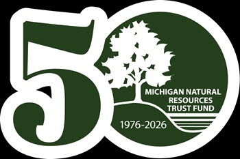 dark green and white graphic Michigan Natural Resources Trust Fund 50th anniversary logo, with the number 50 and years 1976-2026