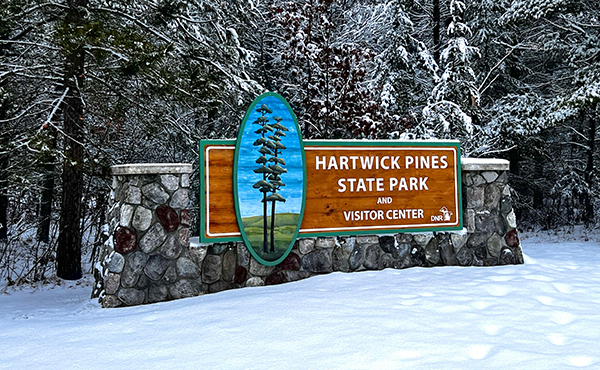 Hartwick Pines State Park sign at the entrance