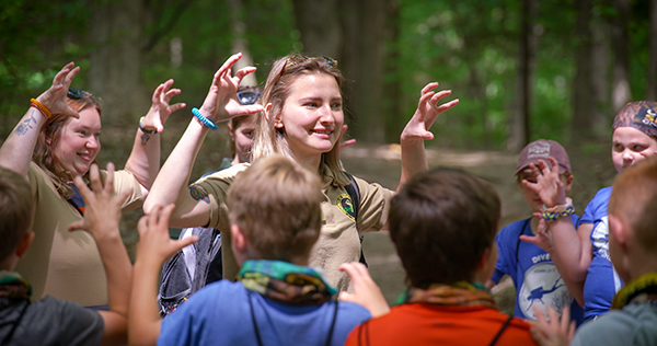 Nature Awaits instructors demonstrate how to show their bear claws on an outdoor outing.