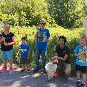 A DNR educator with students after a water activity