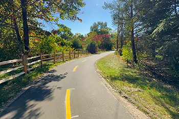 paved Air Line Trail though forest