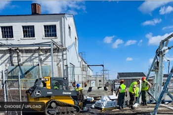 A DNR crew unloads sandbags near Cheboygan Dam and Lock