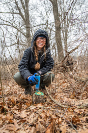 Volunteer smiling with a buckthorn blaster