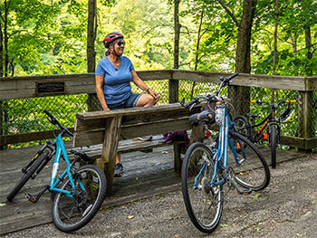biker resting along trail