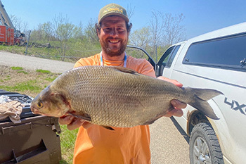 Sedrick Neinhuis holding the state-record gizzard shad he caught April 22 in the Grand River (Kent County).