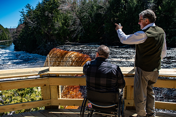 Bryan Wilkinson, co-chairman of the Accessibility Advisory Council, and DNR Director Scott Bowen view the falls.