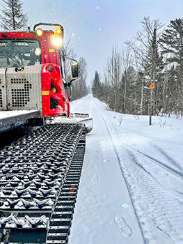A groomer is shown on a trail in Keweenaw County, the home of big snow in the Upper Peninsula.