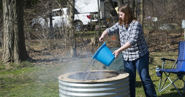 Campfire safety precautions, dousing the fire  