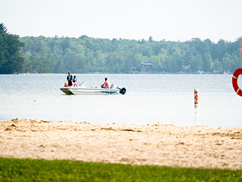 family fishing off boat near state park buoys