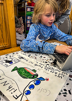 A student making their sketch into a digital graphic.