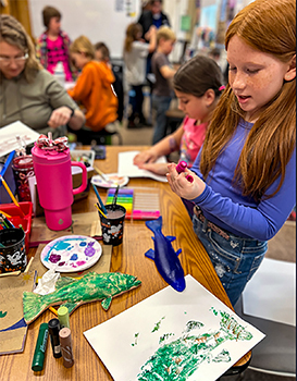 A student at the Gyotaku art station.