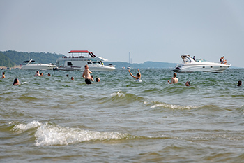 Boating and soaking up the sun on the beach at Grand Haven State Park