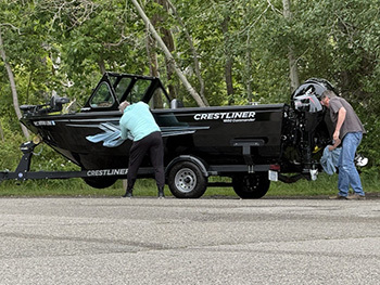 two boaters cleaning their boat