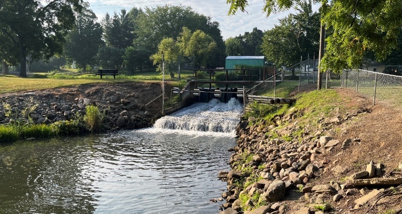 Water flows through the gates of Athens Dam (Calhoun County), one of the projects getting Fisheries Habitat Grant funding in 2025 grant cycle.