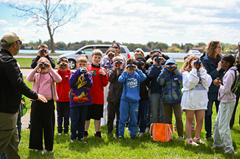 Nature Awaits field trip students learn to use binoculars at Belle Isle State Park