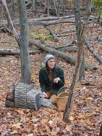 A Becoming an Outdoorswoman instructor teaches foraging for mushrooms at Hoffmaster State Park