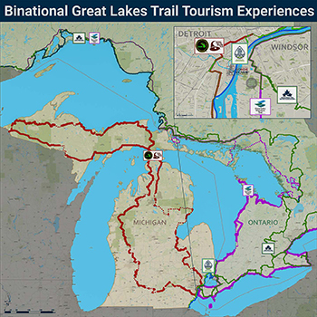 A map showing binational trail connections is shown.