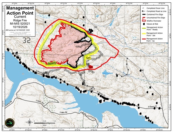 A map shows red, black and yellow containment areas and other details marking the area of Ridge Fire near Marquette