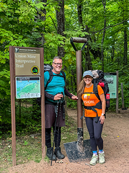 Two hikers, including the author, pose for a photo in the Porcupine Mountains.