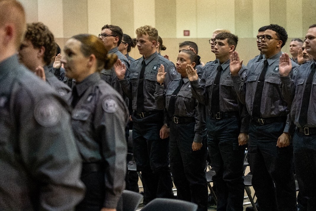 Officer recruits taking their oath of office during the most recent Lower Peninsula academy graduation