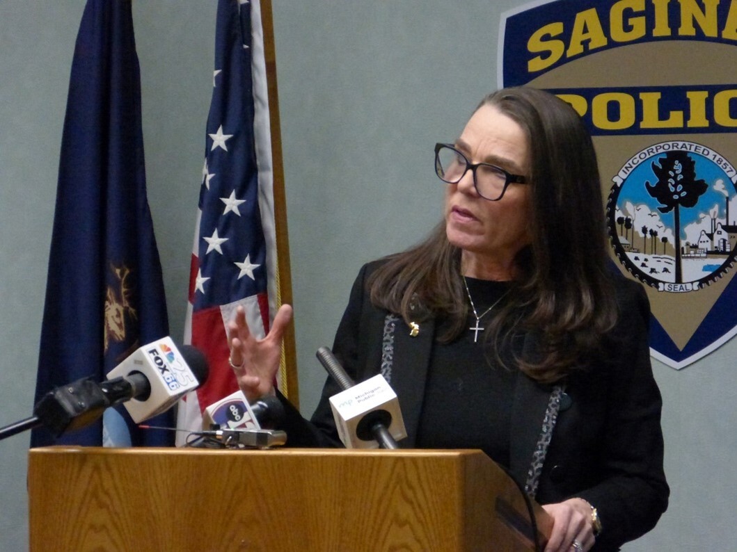 Director Washington speaks at a press conference