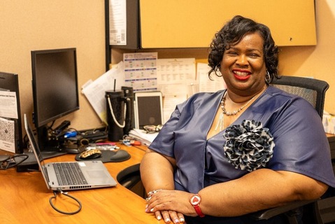 Agent Hughes at her desk