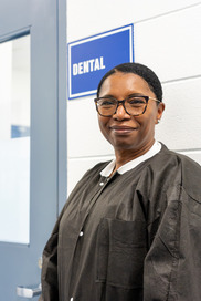 Dr. Maxwell in front of the dental suite at RGC.