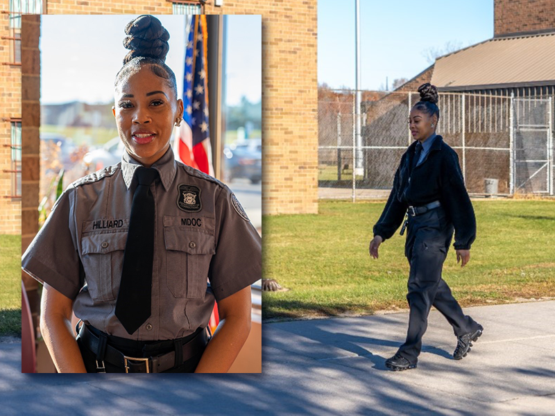 Officer Terria Hilliard in her corrections officer uniform, walking along a path in a facility.
