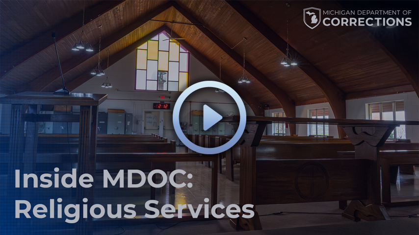 Mock-up of a video with a play button in the center of the image.