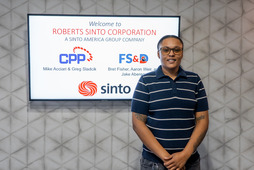 Cara in front of a Sinto sign.