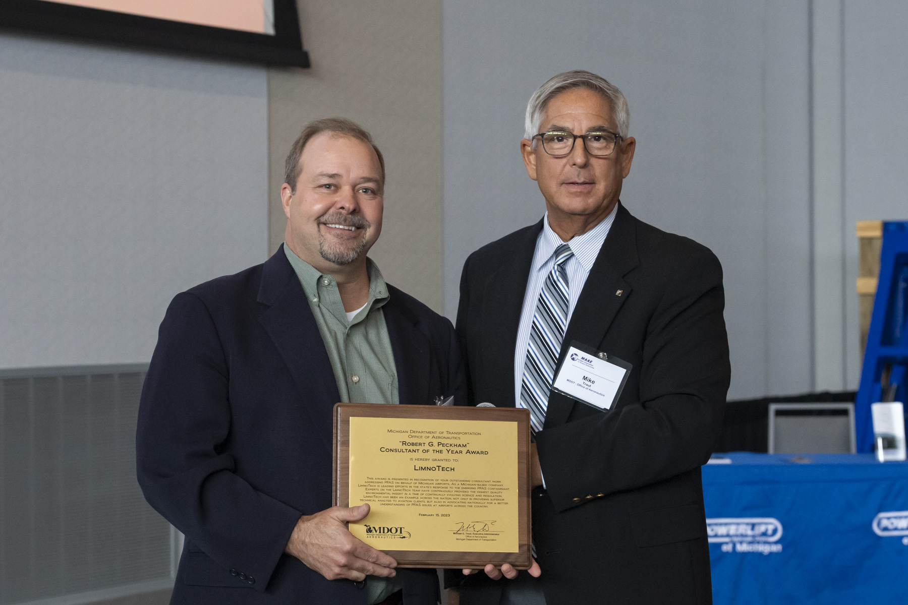 Chris Cieciek (left) of LimnoTech accepts Consultant of the Year Award